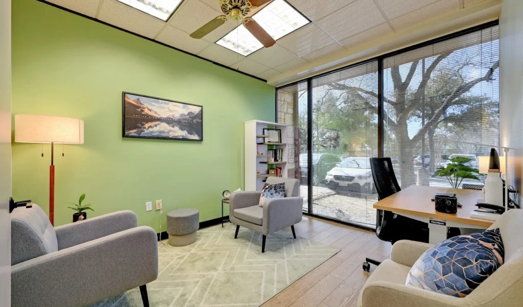 Patient and counselor reviewing an IOP treatment schedule at a recovery center.